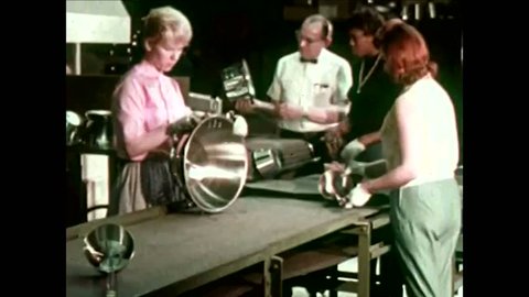 CIRCA -1964 - Women inspect and clean products at a Broomfield factory before packaging them.