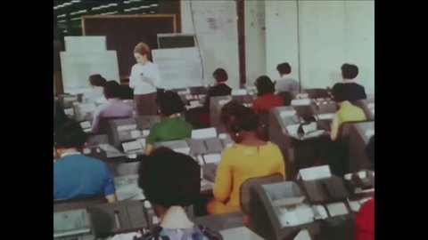 CIRCA 1960s - Training is shown as well as a meeting of executives and Federal Tax Returns are processed.