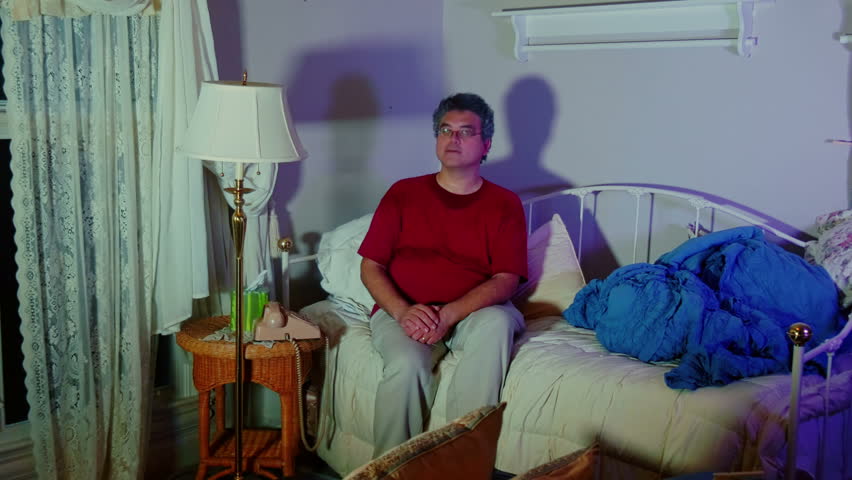 Man talking on an older phone