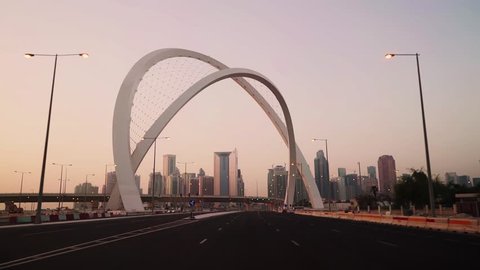 Morning drive through Arc Intersection and revealing West Bay skyline in Doha, Qatar