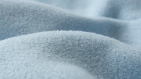 Blue blanket made of polar fleece slow pan 4K video