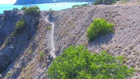 Beutiful Beach, coral Bay, summer, blue laguna, Black sea, sun, view bounty style Top view aerial video beauty nature landscape with beach corals and sea on Crimea island authentic view Aerial ocean