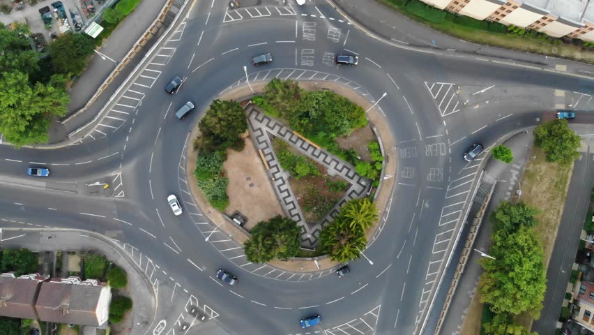 Rotating overhead aerial view of the circular shaped roundabout in Romford , Havering, London, England, Europe