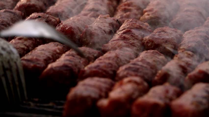 Romanian traditional food Meat Balls "mici" on grill. Slow motion Royalty-Free Stock Footage #1016574655
