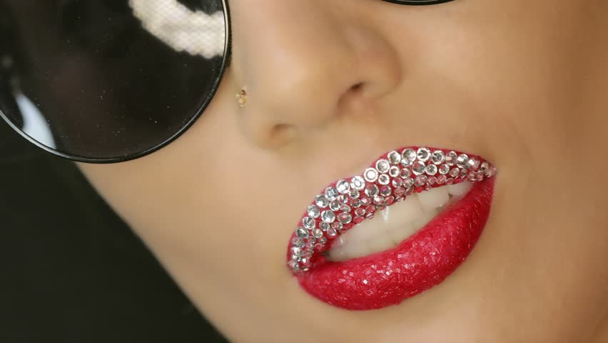Closeup Of A Beautiful Woman Lips With Red And Diamond Closeup Of A Beautiful Woman Lips With