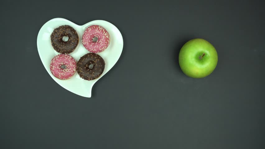 Top view long thinking and making right choice between healthy and junk food.  Royalty-Free Stock Footage #1016583703