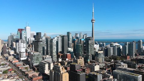 Toronto, Ontario, Canada, aerial view of Toronto cityscape showing Downtown buildings and architectural landmark CN Tower on a sunny day.