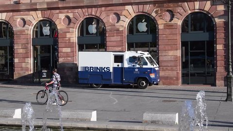 STRASBOURG, FRANCE - SEP 12, 2018: Morning street city scene with Brinks armored security truck cash transportation from Apple Store in France