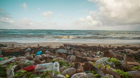Plastic bags and bottles pollute the tropical sandy beaches of Little Corn Island in Nicaragua.