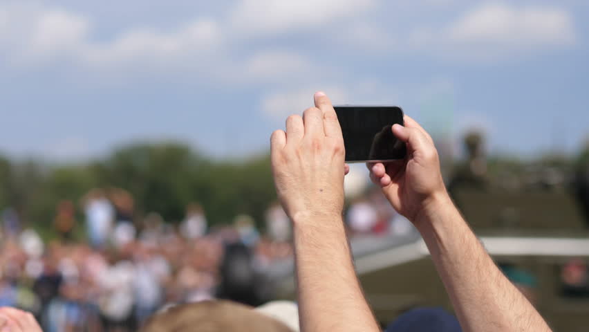 Taking picture of a military parade in 4k slow motion 60fps