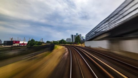 Timelapse of the Docklands in London in motion from a fast moving train, POV hyperlapse