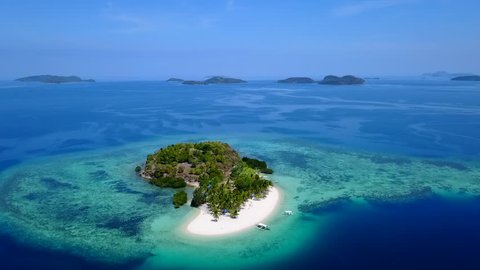 Aerial Tilt Down of a Small Private Tropical Island in the Philippines