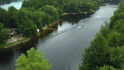 Aerial view of seadoo riding down Muskoka river in cottage country