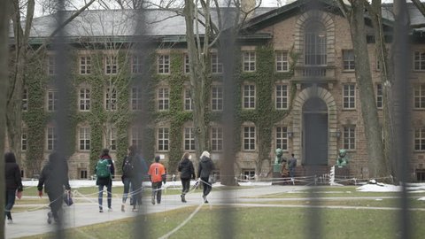 Princeton, NJ / United States - 02 07 2018: Winter 2017 - Tourist walking at Princeton University