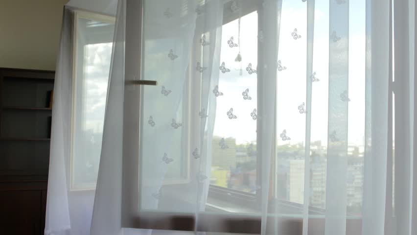 Transparent voile is moving at decorated window. | Shutterstock HD Video #1016613340