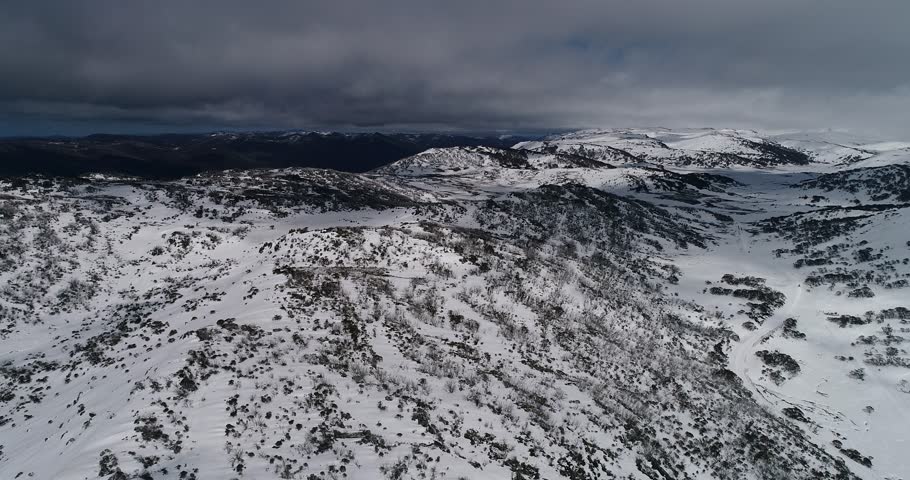 Snow covered road to Charlotte pass along Perisher Valley and Perisher mount in Snowy mountains of Australia down to ski resort town of Perisher valley.
