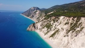 Aerial drone video of iconic paradise beach of Egremni with white rock steep cliff and emerald clear sea, Lefkada island, Ionian, Greece