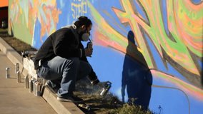 Gangsta Wall Street Art ,Graffiti wall Artist spraying 