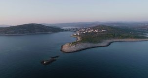 Beautiful 4K aerial video of Dalmatia, Croatia, Europe. Nice nature and landscape on summer sunset at Adriatic Sea and coast. Lovely seascape and outdoors shoot with drone from above in sky.