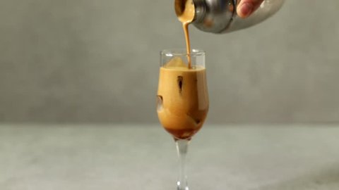 Pouring iced coffee into the glass