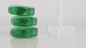 Pile of green gel fresheners with holder slow tilt 4K footage