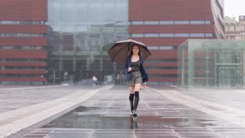 girl walking in rain