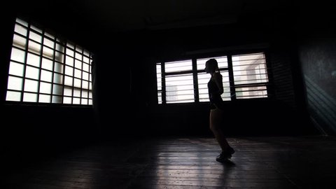 silhouette female boxer in wrapped bandage hands jumping on skipping rope in gym. Fit woman preparing to boxing competition. Wellness, fighting, motivation, martial arts, self defense concept 스톡 비디오