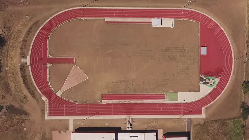 Topshot of stadium, running tracks with sportsmen