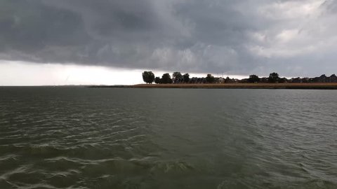 Dark clouds during boattrip between Medemblik and Enkhuizen (The Netherlands)