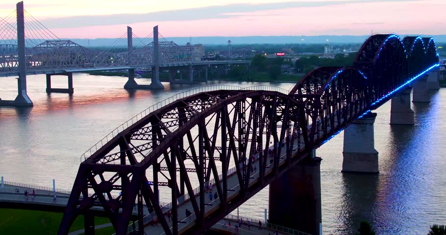 Pull away from Louisville walking bridge sunset