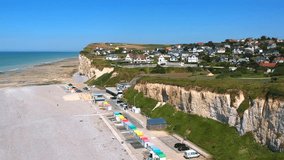 Drone footage of the beach huts, tide pools, the beach & the cliffs of Mesnil-Val-Plage, France.