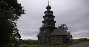 4K cloudy summer day video of Ascension Church, the only wooden cathedral on banks of Tvertsa River in small vintage town Torzhok in Tver Oblast, half way between Moscow and Saint Petersburg, Russia