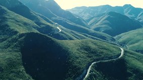 Drone footage full HD, Mountains covered by very green grass and trees, big routes between the mountains, these videos were shoot close to Georges in the the garden route JUN 2028