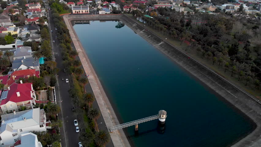 Aerial footage of a city reservoir in Cape Town South Africa