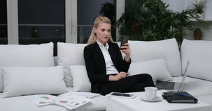 Business Woman Talk Video Conference to Partner Use Mobile Phone Sit Office Sofa