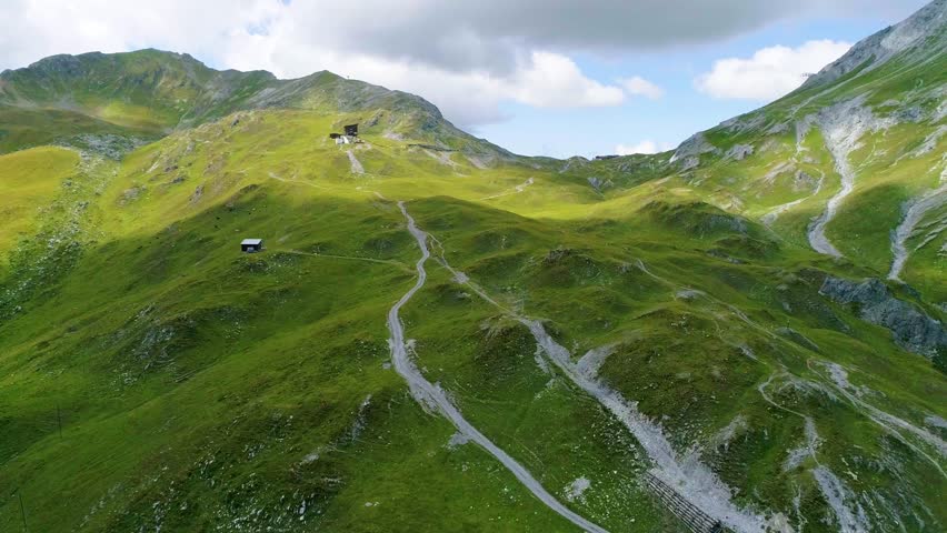 4K aerial shot approaching mountain top at cloudy sky
