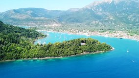 Aerial drone bird's eye view video of iconic port of Nidri or Nydri a safe harbor for sail boats and famous for trips to Meganisi, Skorpios and other Ionian islands, Lefkada island, Ionian, Greece