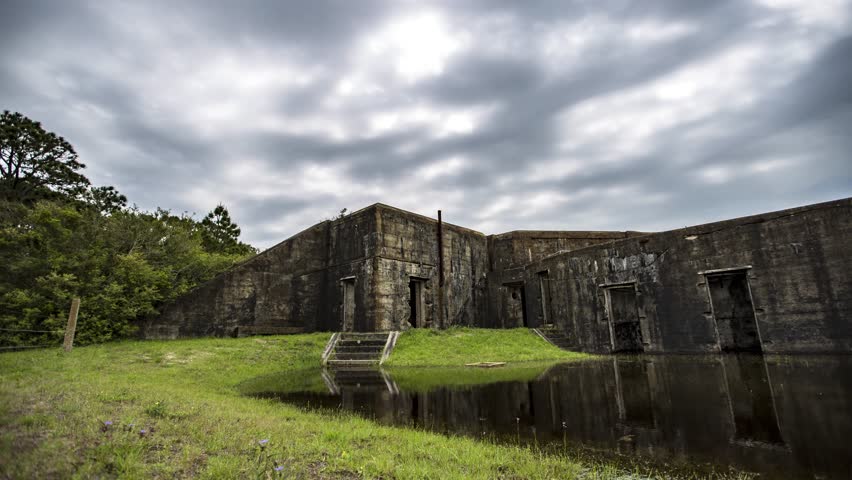 Motion time lapse of the daytime clouds, panning the Battery Bowyer at Fort Morgan historic bastion, at Mobile Bay, Alabama