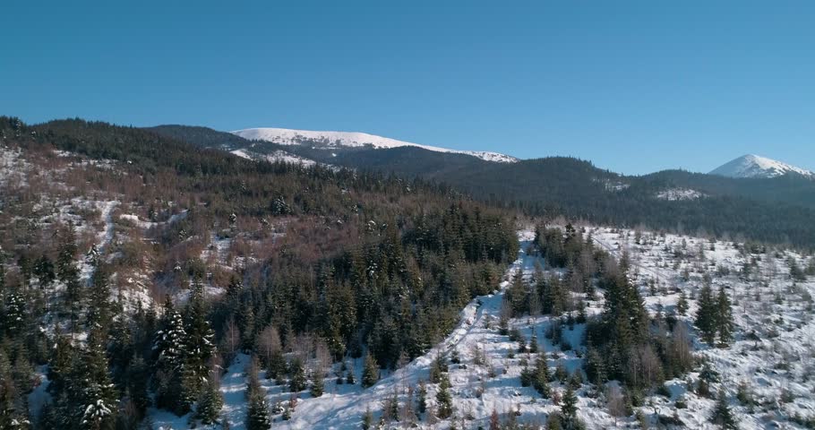Aerial view of the mountains. Blu sky. Winter. Snow. Bukovel. Ukraine. | Shutterstock HD Video #1016676145