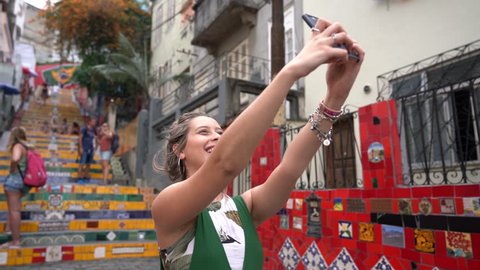 Happy beauty young brazilian woman taking a selfie photo in a famous and culture turistic place in Rio de Janeiro, Brazil
