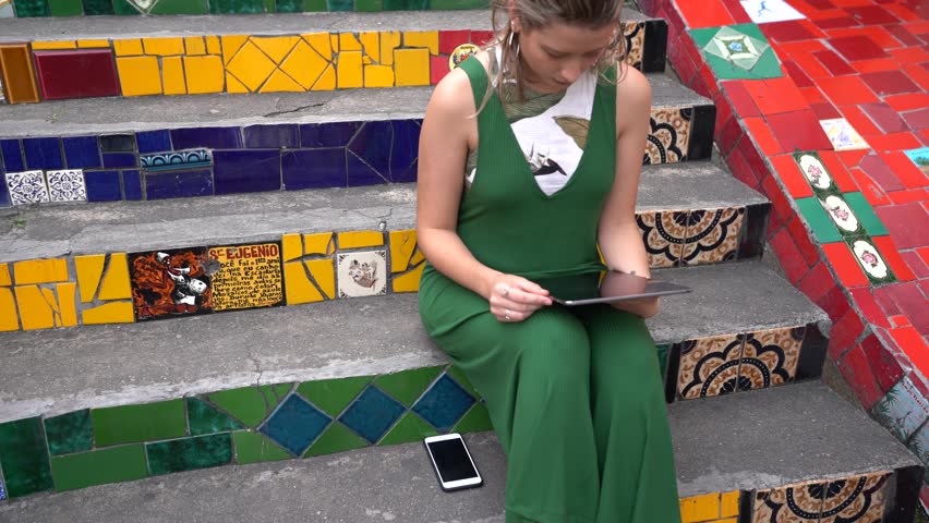 Happy beauty young brazilian woman working in a famous and culture turistic place in Rio de Janeiro, Brazil