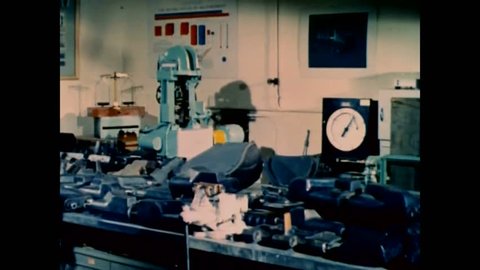 CIRCA 1960s - Early 1960s footage of scientists in a lab improving U.S. Army vehicles through research and development.