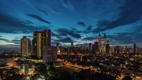 Time lapse of Kuala Lumpur City Center from night to day transition with beautiful cloud formation. Left to right transition effect.