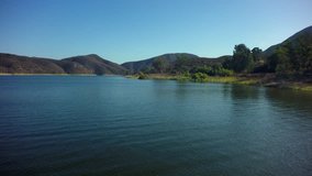 Flying over Lake Hodges Reservoir in North San Diego County, California, USA.  4k Aerial Drone Footage.