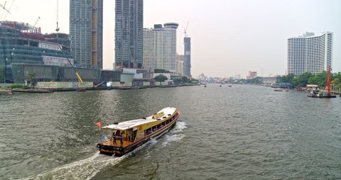 Thailand Bangkok Aerial v60 Panning low around moving boat path with waterfront views 3/18