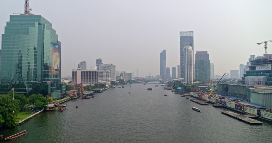 Thailand Bangkok Aerial v42 Flying very low over river route with riverfront & bridge view 3/18