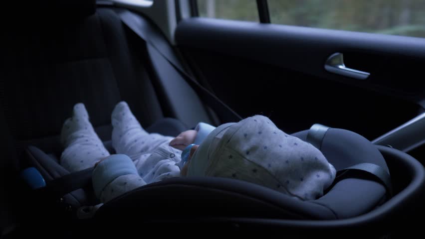 Little baby boy sitting in car seat riding in backseat of car Royalty-Free Stock Footage #1016698237