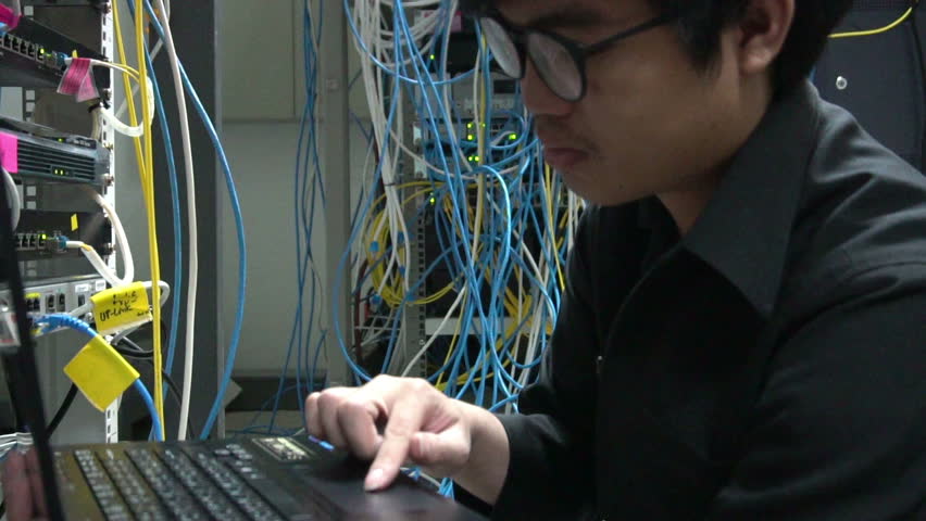 Engineer  come to server room for work,check problem of network,repair server in the server room,thailand people,asian man	 Royalty-Free Stock Footage #1016700541