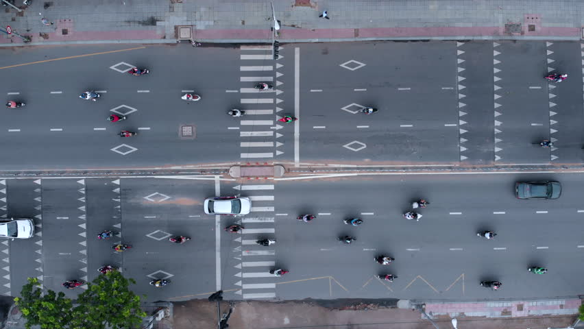 Top down aerial view of traffic on busy street in Ho Chi Minh City, aka Saigon, the largest city in Vietnam. 