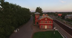 4K afternoon high quality aerial video view of old vintage but still used railway station designed by architect Benua, in the southern Saint Petersburg's suburb Strelna, the Russia's northern capital